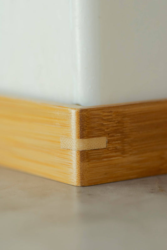 Corner view of wooden soap holder.