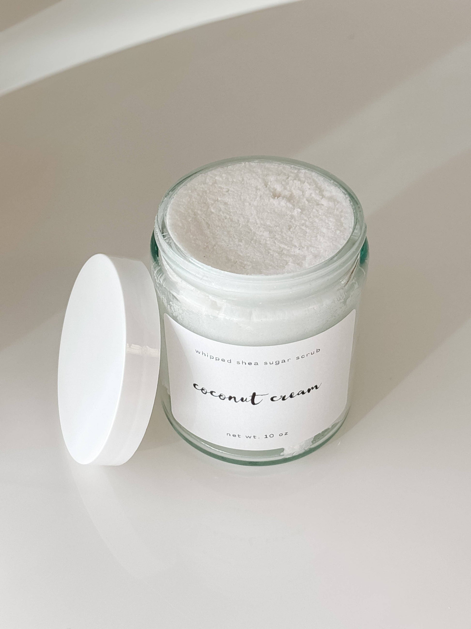 Jar of coconut cream on a light background