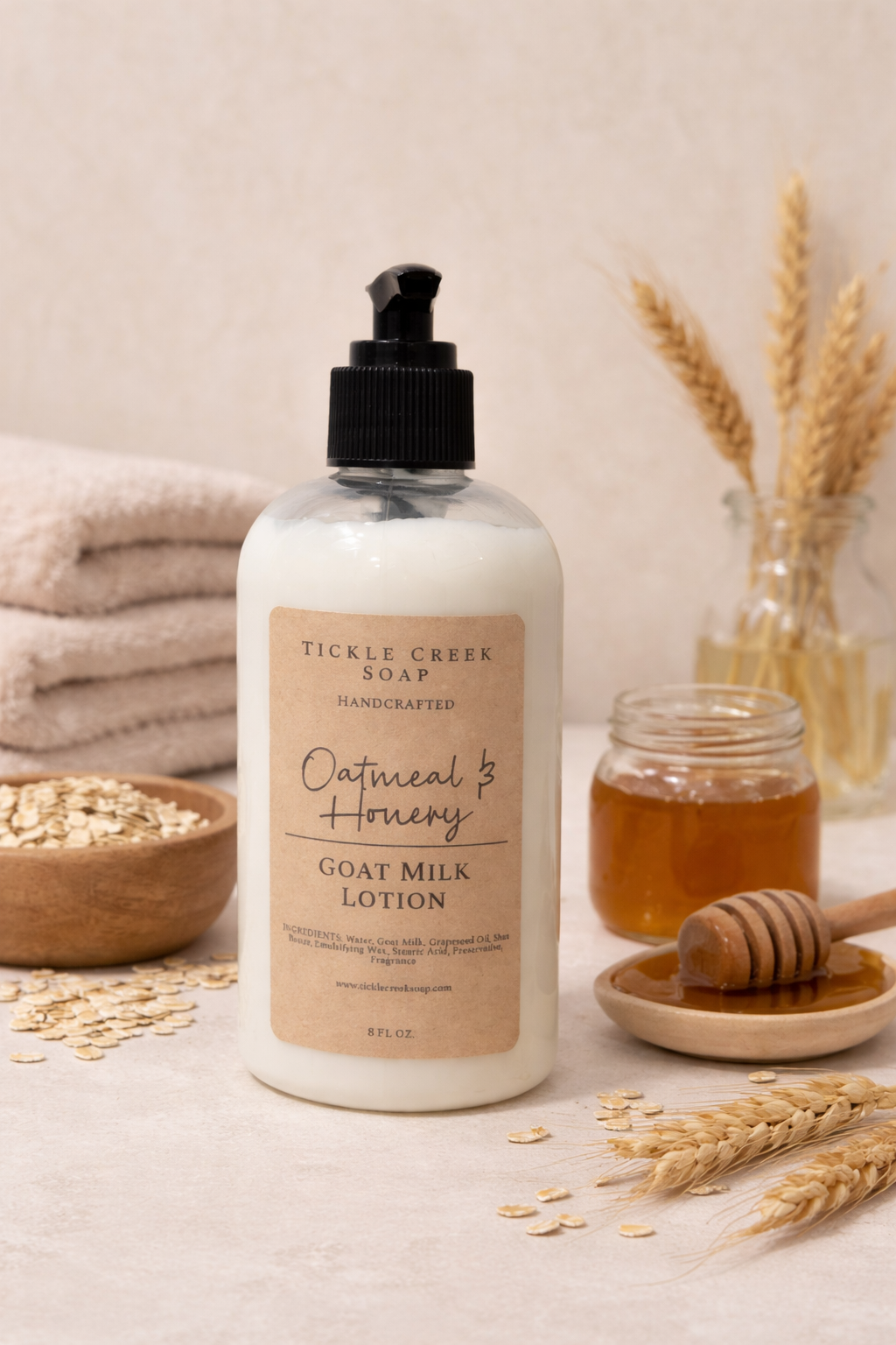 Goat milk lotion bottle with 'Oatmeal & Honey' label on a neutral background with oats and honey.